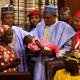 Nigerian President Mohammadu Buhari holds the daughter of the kidnapped Chibok schoolgirl Amina Ali at her arrival at the presidency in Abuja, Nigeria, on May 19, 2016. (Florian Plaucheur/AFP/Getty Images)